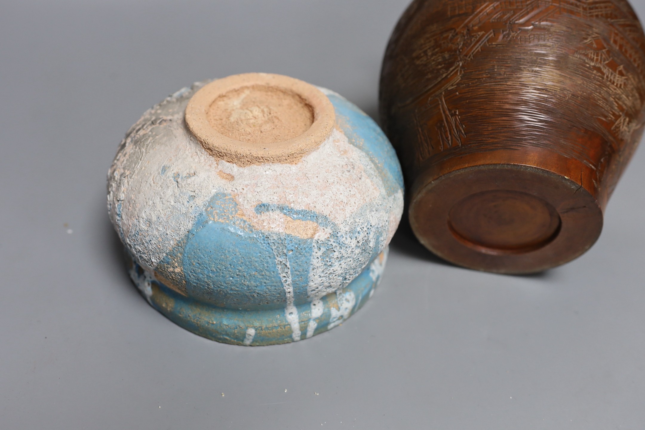 Two Japanese stoneware tea bowls (chawan), a Japanese raku bowl and a Japanese carved wood tea caddy, 19cm